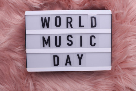 World music day text in light box on fuzzy fluffy pink backgroundの写真素材