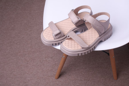 Women's Leather Sandals On A Chairの写真素材