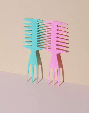 Plastic combs on pastel background. Beauty concept. Creative layout. Minimalismの写真素材