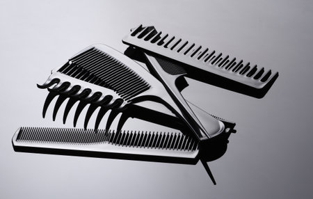 Set of plastic combs on black background close-up