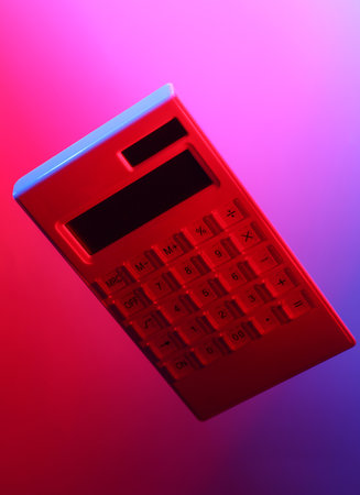 Calculator in red blue neon lightの写真素材