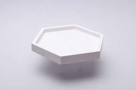 Plaster hexagon tray on a gray backgroundの写真素材