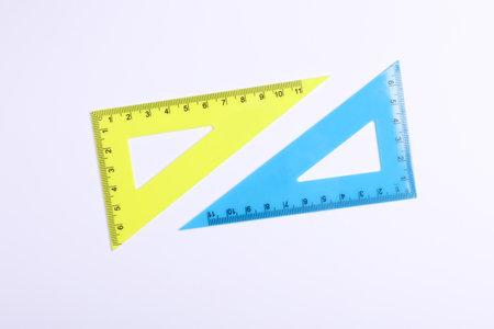 Rulers triangles on white background. Top view