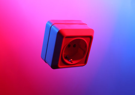 Electrical outlet in red blue neon lightの写真素材