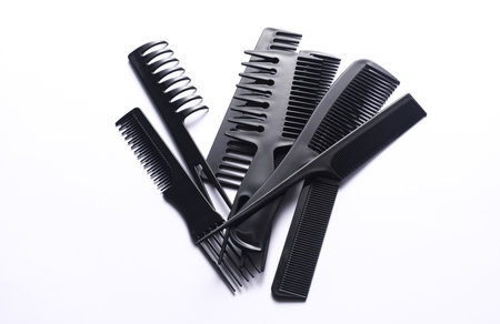 Set of black plastic combs on white backgroundの写真素材