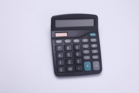 Black classic calculator on white backgroundの写真素材