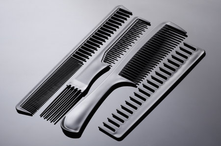 Set of plastic combs on black background close-up