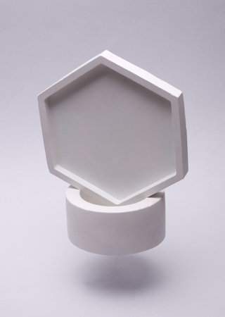 White Plaster Trays Floating on Gray Backgroundの写真素材