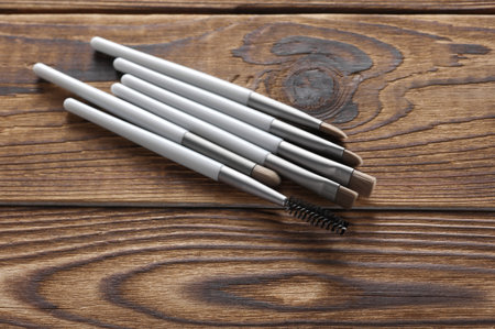 Makeup brushes on wooden background. Top viewの写真素材