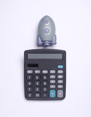 Calculator with rocket on white background. Startup, business conceptの写真素材