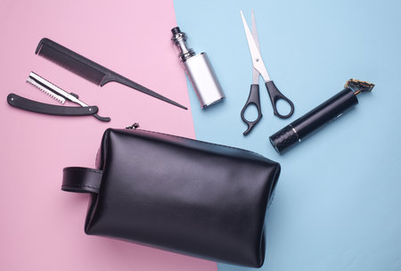 Men's cosmetic bag with barber tools on a pink blue backgroundの写真素材