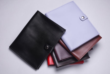 Leather organizers for important papers and documents on a white background