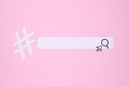 Paper search bar with cursor and hashtag on pink background. Business conceptの写真素材