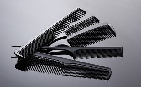 Set of plastic combs on black background close-up