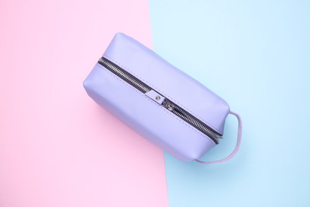Purple Leather cosmetic bag organizer on pink blue backgroundの写真素材