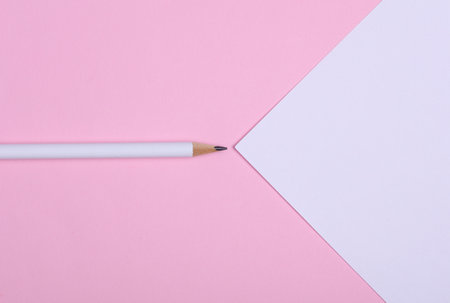 White wooden pencil with paper sheet on pink background. Mockup for designの写真素材