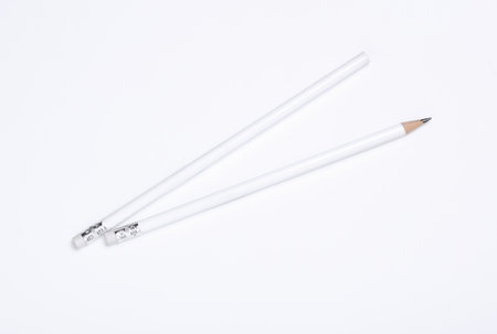 White wooden pencils with erasers on white background. Mockup for designの写真素材