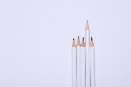 White wooden pencils on white background. Mockup for designの写真素材