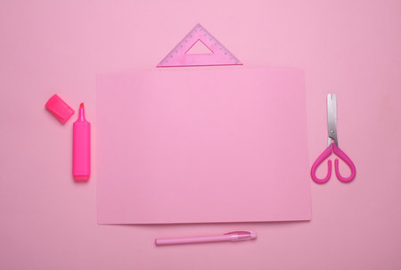 Pink sheets of paper with school stationery on pink background. Monochrome photography. Flat layの写真素材