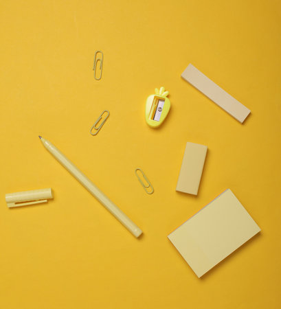 Stationery on a yellow background. View from above. Flat lay.の写真素材