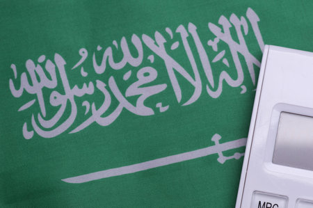 Saudi Arabia flag with calculator close upの写真素材