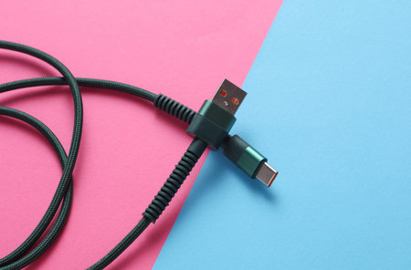 USB cable on blue pink background