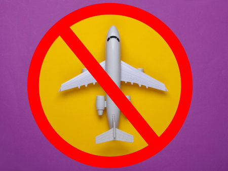 The prohibition of air travel. Passenger airplane model with a prohibition signの写真素材