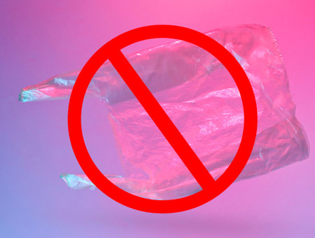 Minimalism pollution ecology concept. Crumpled plastic bag in neon red blue light with prohibition signの写真素材