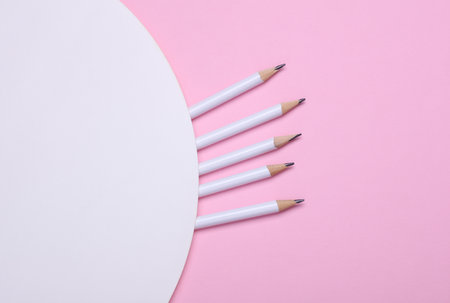 White wooden pencils on pink background. Mockup for designの写真素材
