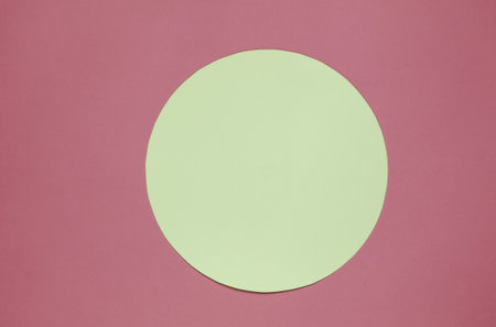 Pink background with yellow pastel circle for copy spaceの写真素材