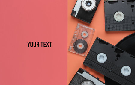 Retro objects. Retro camera, vinyl record, video cassettes, audio cassette on a colored background...