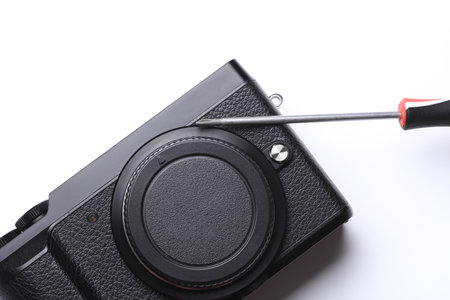 Photographic equipment repair. Camera with a response on a white backgroundの写真素材