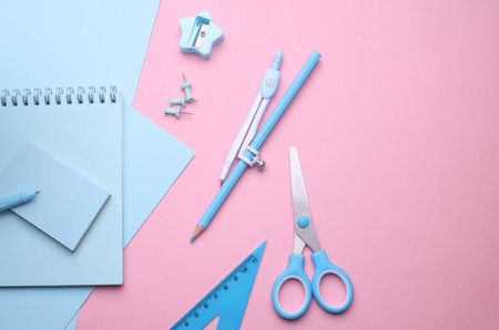 Blue Stationery set on pink pastel background. Back to school, education, office supplies. Flat lay....