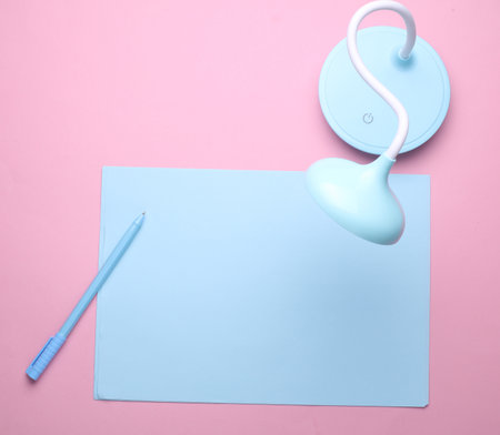 Blue Stationery set on pink pastel background. Back to school, education, office supplies. Flat lay. Top view. Creative layoutの写真素材