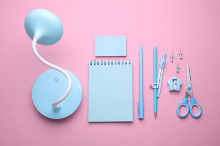 Blue Stationery set on pink pastel background. Back to school, education, office supplies. Flat lay. Top view. Creative layoutの写真素材