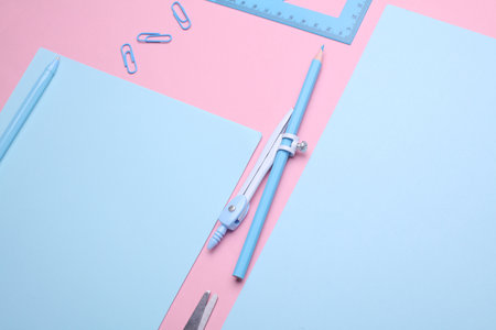 Blue Stationery set on pink pastel background. Back to school, education, office supplies. Flat lay. Top view. Creative layoutの写真素材