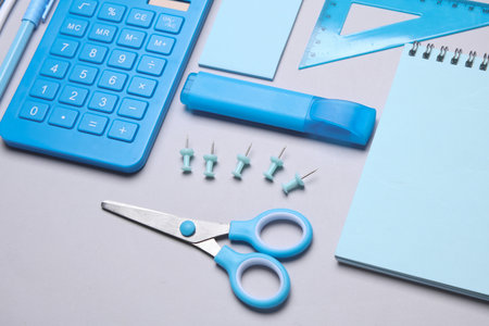 Blue Stationery set on gray background. Back to school, education, office supplies. Flat lay. Top view. Creative layoutの写真素材