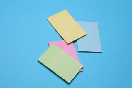 Set of colored memo stickers on blue backgroundの写真素材