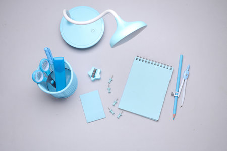 Blue Stationery set on gray background. Back to school, education, office supplies. Flat lay. Top view. Creative layoutの写真素材