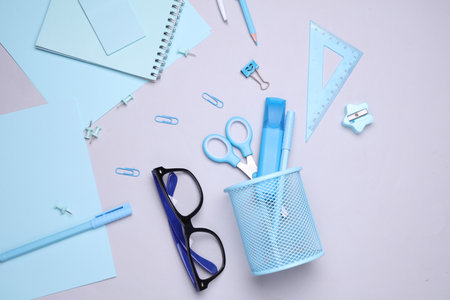 Blue Stationery set with paper sheets on gray background. Back to school, education, office supplies. Flat lay. Top view. Creative layoutの写真素材