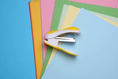 Stapler and Set of Colored Paper Sheetsの写真素材