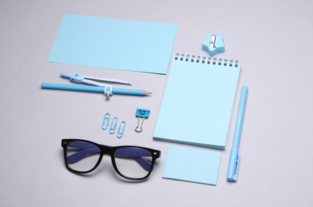 Blue Stationery set on gray background. Back to school, education, office supplies. Flat lay. Top view. Creative layoutの写真素材