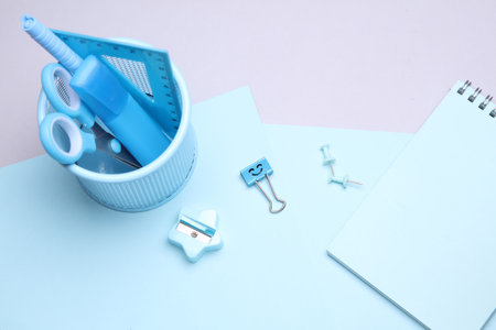 Blue Stationery set with paper sheets on gray background. Back to school, education, office supplies. Flat lay. Top view. Creative layoutの写真素材
