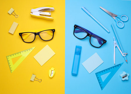 Stationery set on colored background. Back to school, education, office supplies. Flat lay. Top view. Creative layoutの写真素材
