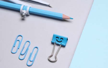 Blue Stationery set on gray background. Back to school, education, office supplies. Flat lay. Top view. Creative layoutの写真素材