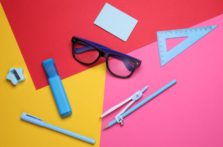 Stationery set on colored background. Back to school, education, office supplies. Flat lay. Top view. Creative layoutの写真素材