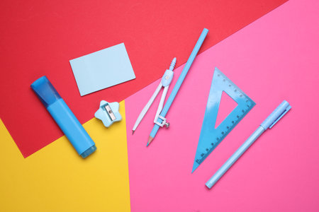 Stationery set on colored background. Back to school, education, office supplies. Flat lay. Top view. Creative layoutの写真素材