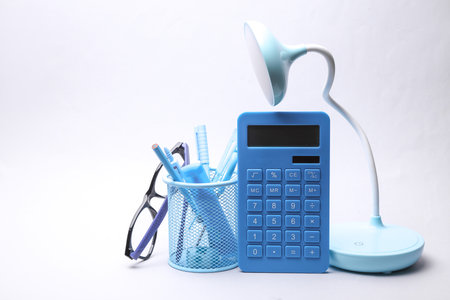 Bucket with blue stationery set on gray backgroundの写真素材