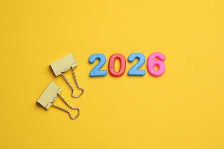 2026 year text with multicolored numbers and binder clips