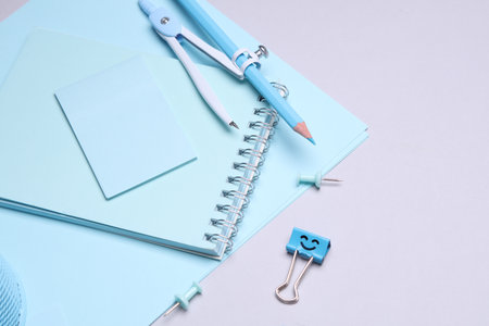 Blue Stationery set with paper sheets on gray background. Back to school, education, office...